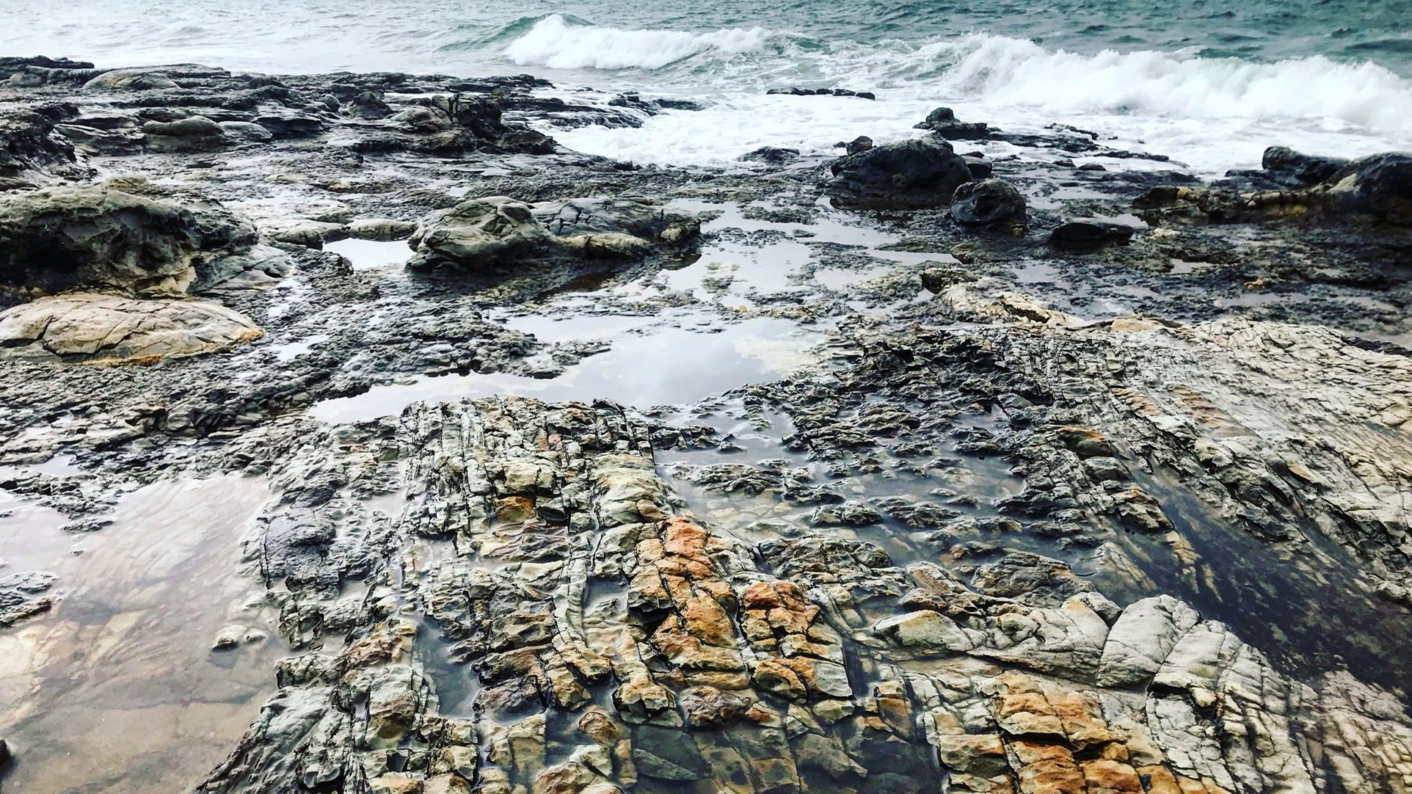 rocks at the edge of the ocean